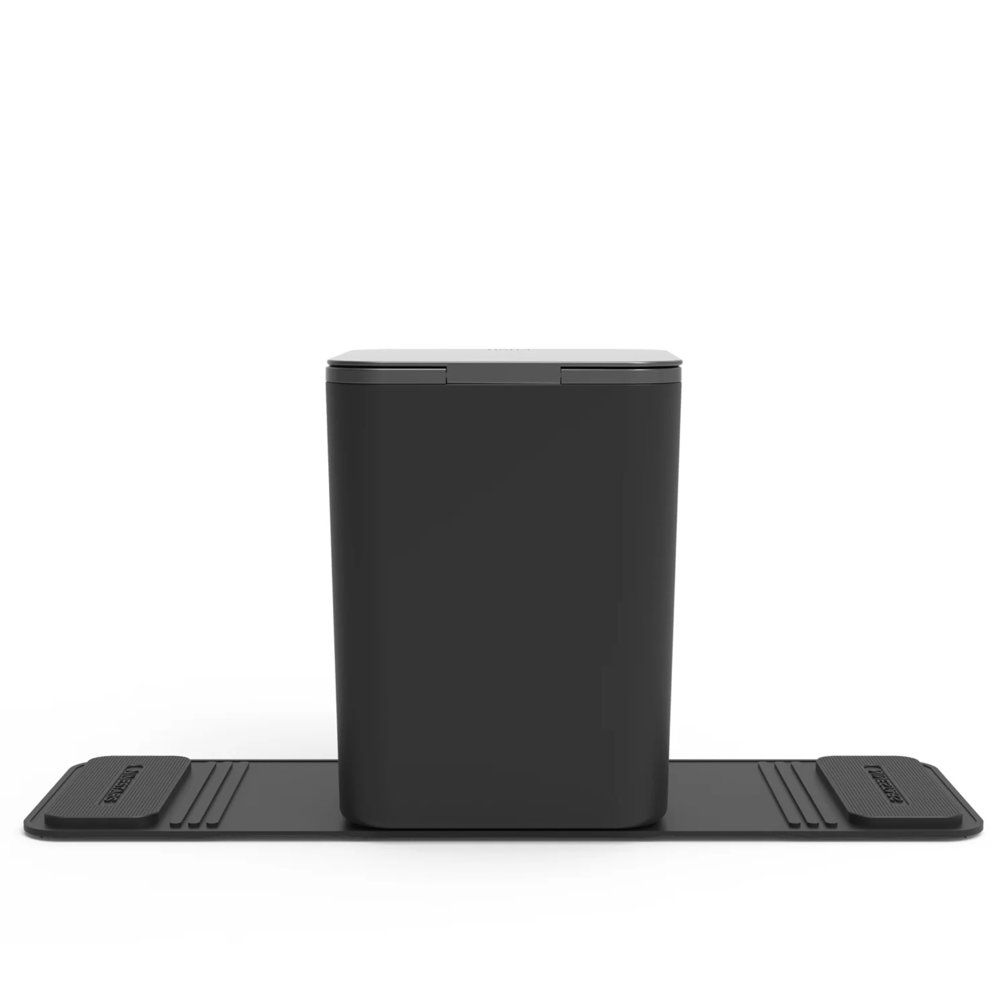 Back view of a black medium sized rectangular car trash can with stability flap and closed lid on a white background