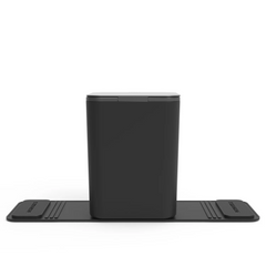 Back view of a black medium sized rectangular car trash can with stability flap and closed lid on a white background