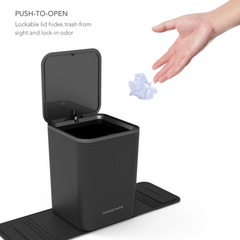 Black trash bin with lockable lid being pushed open by a hand.