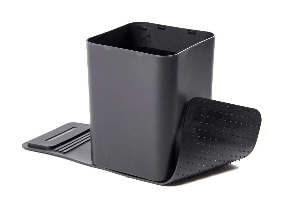 A medium-sized black car trash can with no lid and a pair of dark colored grip strips attached to its base.