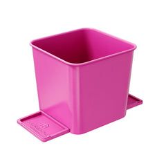 A small pink car trash can with stability flap on a white background.