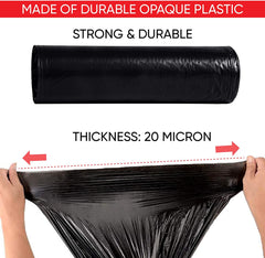 Black drawstring trash bag roll made of durable plastic, 20-micron thick, strong and tear-resistant garbage bag stretched by hands for durability demonstration.
